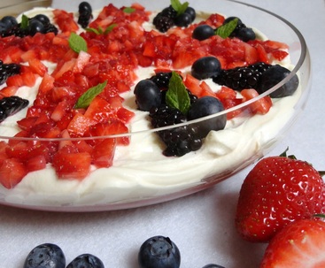 Summer berry trifle decorated with berries so that it looks like the Union Jack